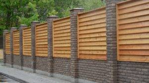 Fence panels between brick posts