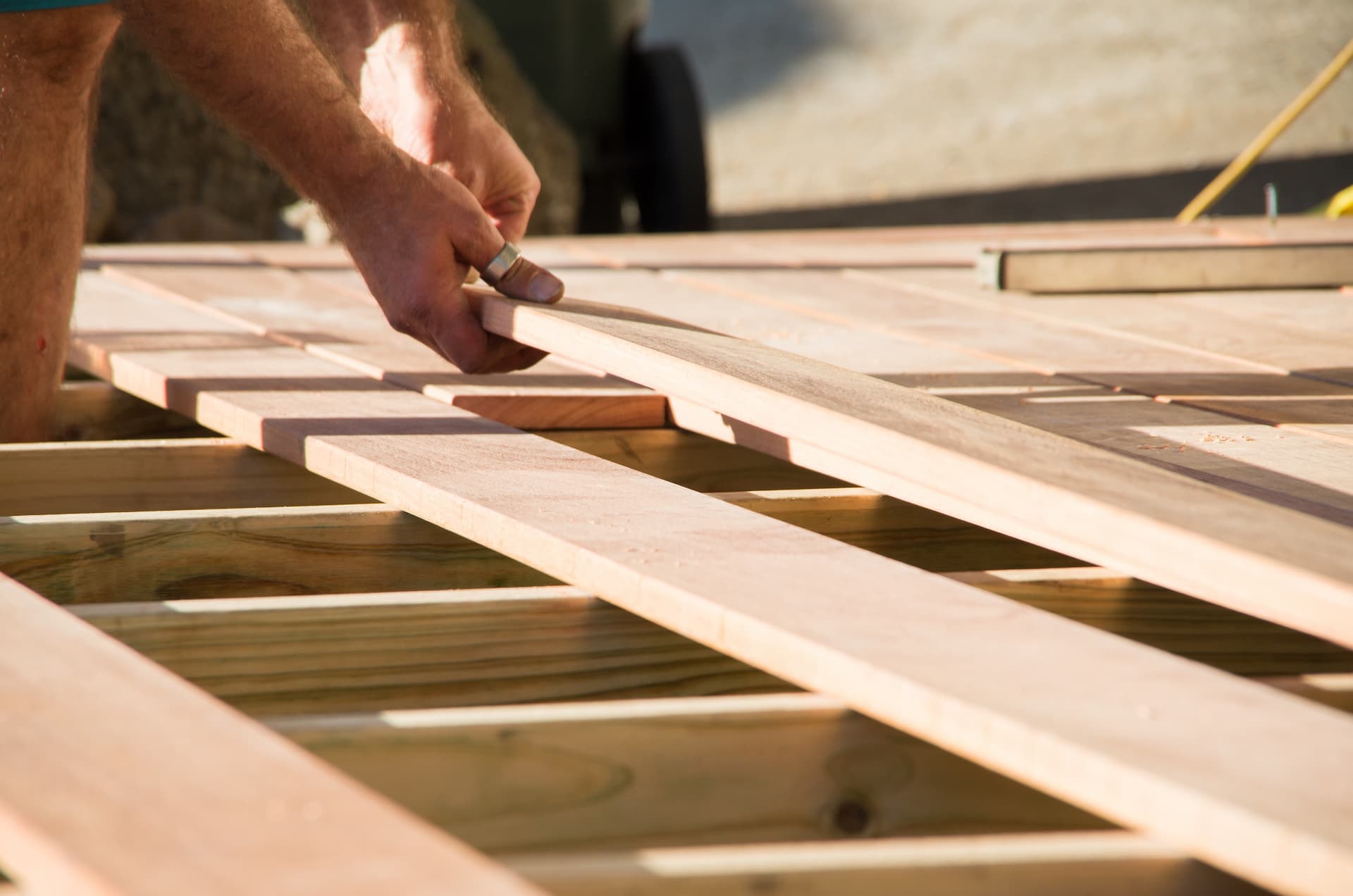 a contractor setting up decking